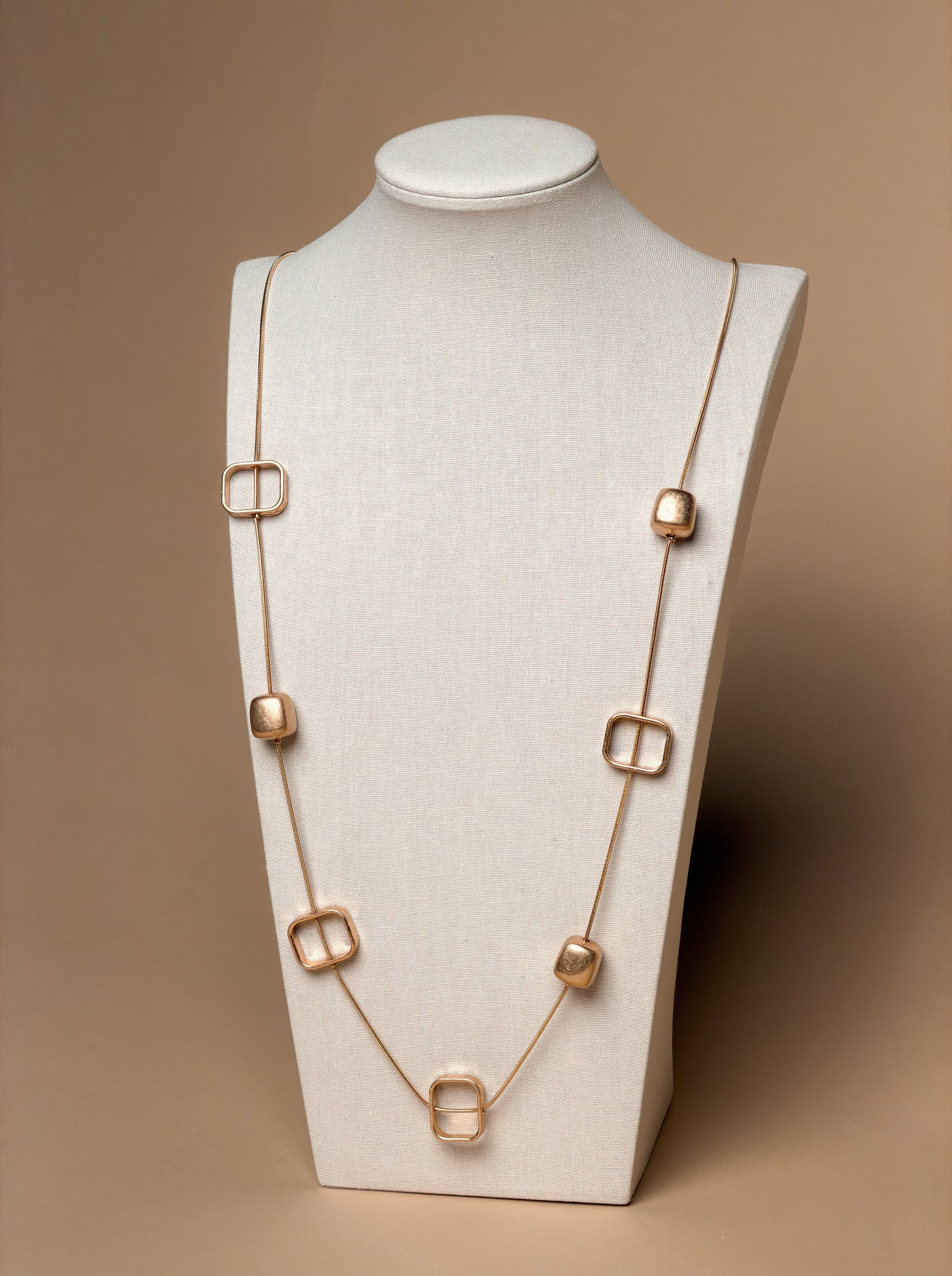 Long Gold Snake Chain Necklace with Geometric Accents