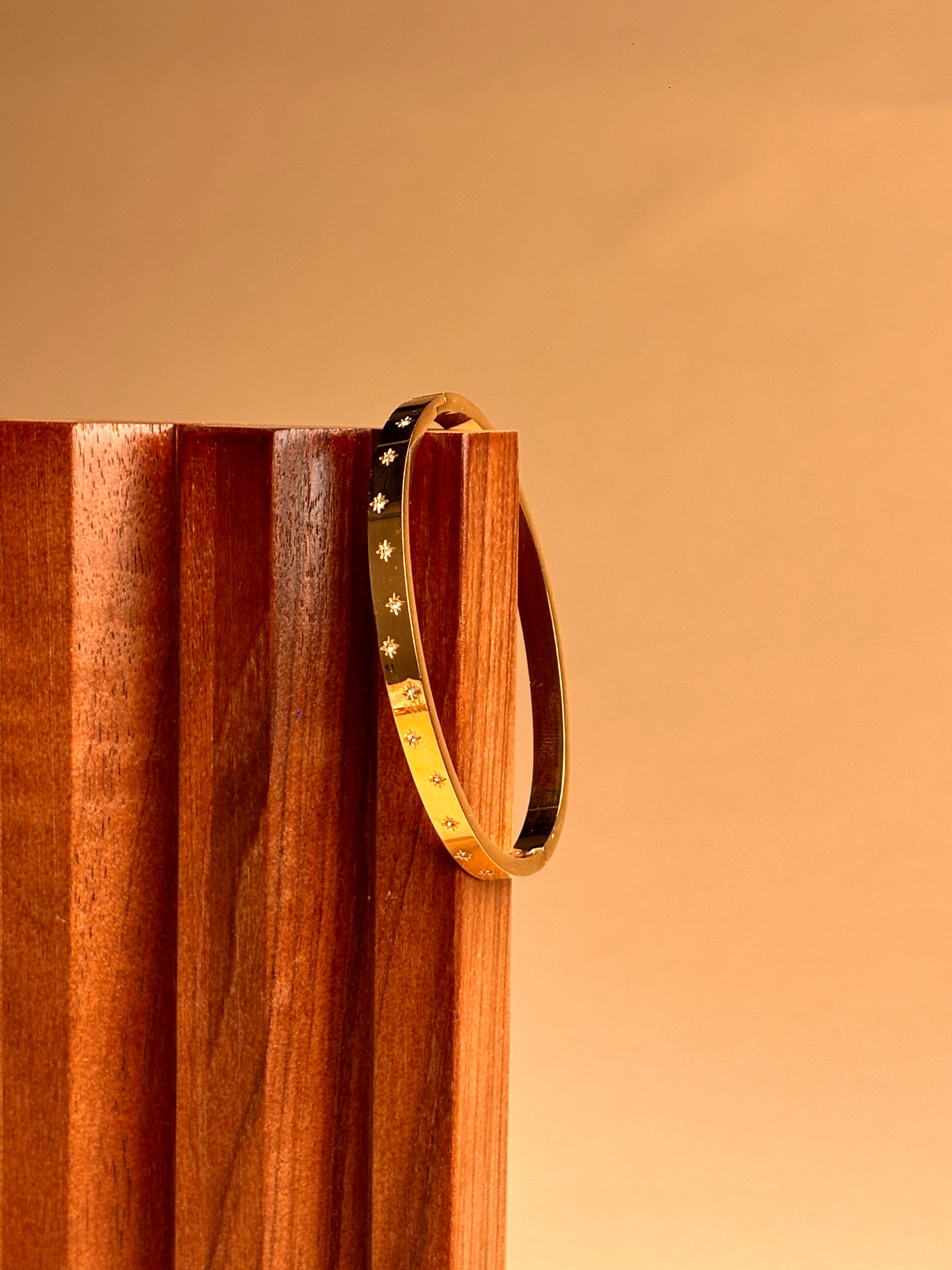 Sleek Gold Bracelet with Stone Work